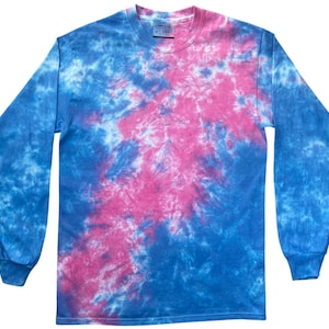 May include: A long-sleeved tie-dye shirt in shades of blue and pink. The shirt has a crew neck and long sleeves with ribbed cuffs. The tie-dye pattern is a spiral design, with the pink colour concentrated in the centre and the blue on the outside.