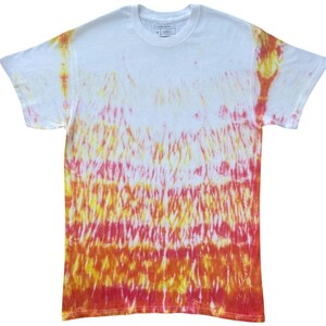 May include: A short-sleeve crew neck t-shirt featuring a tie-dye pattern that transitions from white at the top to vibrant shades of yellow, orange, and red toward the bottom hem. The garment has a standard fit with a white collar and interior label.
