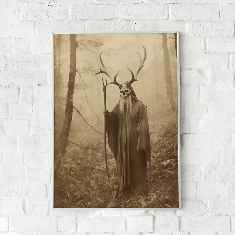 May include: Sepia-toned print of a figure in a forest, wearing a skull mask with antlers and a long robe, holding a staff. The image evokes a mystical or fantasy theme, with a vintage aesthetic. The background features trees and foliage.