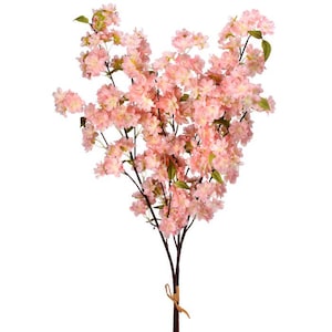 May include: A faux cherry blossom branch with numerous clusters of soft pink flowers and green leaves. The dark brown stems extend upwards, creating a full and textured appearance. A decorative floral accent for home decor.