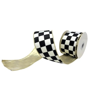 May include: A roll of decorative ribbon featuring a black and white checkered pattern on one side and a solid metallic gold finish on the reverse. The edges of the ribbon are finished with a thin gold wire trim, providing structure to the fabric.