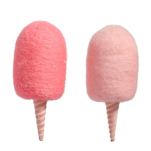 May include: Two cotton candy decorations. One is a vibrant pink, the other a softer shade of pink. Both have a textured, fluffy appearance and are mounted on a white and pink striped cone. The background is plain white.