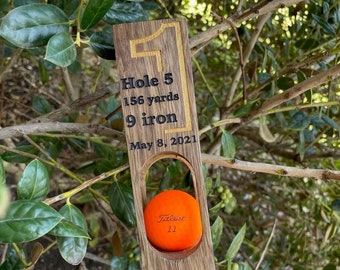 Hole in one golf ball display