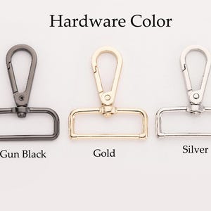 May include: Image of three metal hardware pieces in gun black, gold, and silver. Each piece includes a swivel clasp and a rectangular ring. The text "Hardware Color" is at the top, with the color names below each piece.