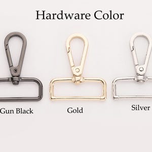 K&ouml;nnte beinhalten: Drei Metallschlie&szlig;en in Schwarz, Gold und Silber. "Hardware Color" steht &uuml;ber den Schlie&szlig;en.