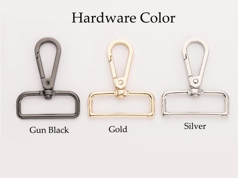 K&ouml;nnte beinhalten: Drei Metallschlie&szlig;en in Schwarz, Gold und Silber. "Hardware Color" steht &uuml;ber den Schlie&szlig;en.
