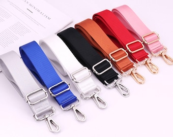 May include: Eight different colored adjustable straps with silver swivel clasps. The straps are made of a woven fabric and are available in white, blue, black, brown, red, pink, and two shades of gray.