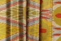 Gold and Red Silk Ikat Fabric - Boho Upholstery Material by Metre, Designer Dressmaking Textile product logo