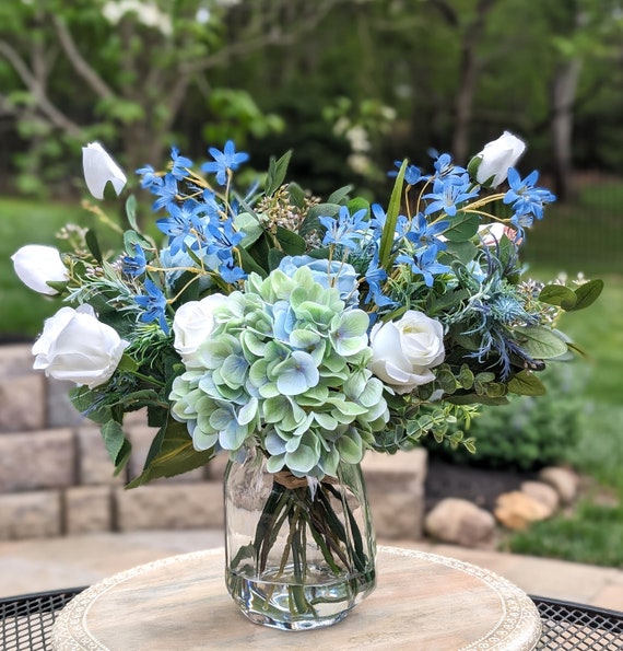 A Continental Blue and White Floral Garden Vase. A Continental Blue and White Floral Garden Vase.