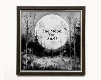 May include: A black and white framed print featuring a watercolour painting of a full moon in a forest. The text "The Moon, You And i." is written in the centre of the image.