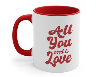 May include: White ceramic mug with a red interior and handle. The mug features the text "All You need is Love" in red cursive lettering.