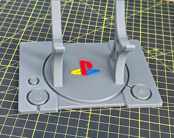 Soporte para mando DualSense de PS5: diseño inspirado en la PlayStation original clásica