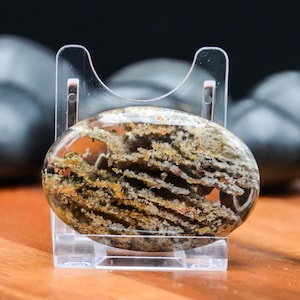 May include: A handmade wooden sign with the text "Welcome to our home" in a handwritten style. The sign is painted white with black lettering and a distressed finish, suitable for indoor or outdoor use.