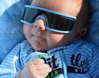 Sunzeez for "Newborn" babies!  Undeveloped eyes need  protection from UV rays. Protect Your New Baby! Easy Use! Sunzeez Infant Sunglasses!