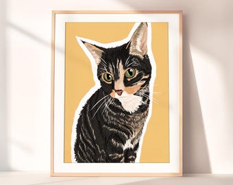 May include: A framed illustration of a black, white, and orange tabby cat with green eyes. The cat is sitting on a yellow background.