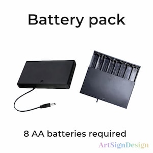 May include: A black battery pack with a cord and plug. The pack is open and contains eight AA batteries. The text "Battery pack" is at the top of the image and the text "8 AA batteries required" is at the bottom of the image.