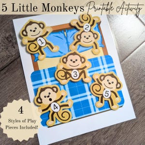 May include: A printable activity featuring five cartoon monkeys numbered 1-5. The monkeys are tan with brown accents and are arranged on a bed with blue plaid bedding. The text "5 Little Monkeys Printable Activity" is at the top. The image also includes the text "4 Styles of Play Pieces Included!"