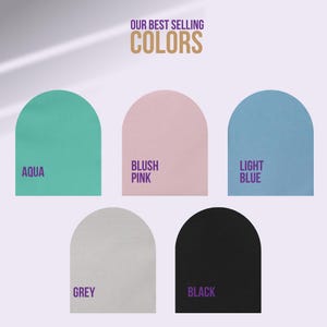 May include: A color chart featuring the text OUR BEST SELLING COLORS and five arched shapes in aqua, blush pink, light blue, grey, and black. Each arch is labeled with its corresponding color name in purple text below or beside the shape.