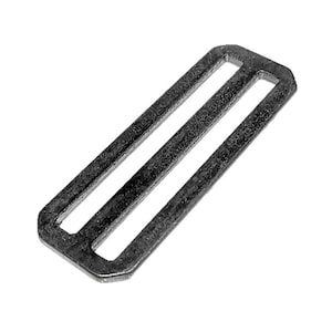 May include: A silver metal slider buckle with two slots. The buckle is rectangular in shape and has rounded edges.