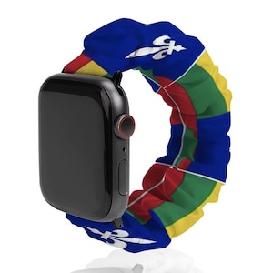 May include: A black smartwatch with a scrunchie-style fabric watch band featuring a repeating pattern of the Central African Republic flag, which includes blue, white, green, yellow, and red stripes with a yellow star and a white fleur-de-lis.