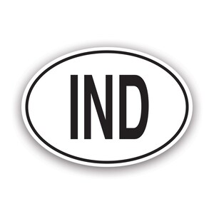 May include: White oval sticker with black text that reads "IND".