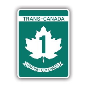 May include: A green and white sign with the text "TRANS-CANADA" and "BRITISH COLUMBIA". A white maple leaf with the number "1" inside is in the center of the sign.