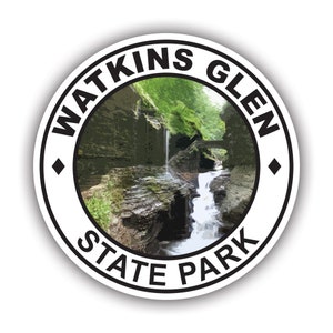 May include: A white circle sticker with black text that reads "Watkins Glen State Park". The sticker features a photo of a waterfall in a rocky gorge.