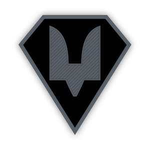 May include: A black diamond-shaped patch with a gray stylized letter V in the center.