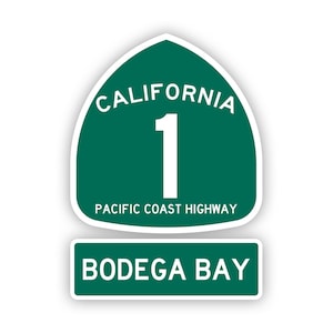 Könnte beinhalten: Ein grünes und weißes Schild der California Highway 1 mit dem Text "Pacific Coast Highway" und "Bodega Bay".