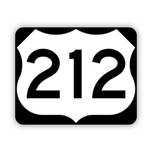 May include: A white highway sign with black lettering and a black border. The sign is shaped like a shield and has the number "212" on it.