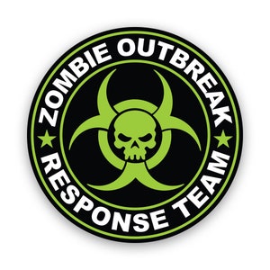 May include: Black and green round sticker with a biohazard symbol and the text "Zombie Outbreak Response Team" in white.