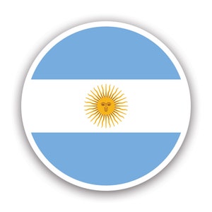 May include: A circular sticker with the flag of Argentina. The flag is light blue with a white stripe in the middle and a yellow sun with a human face in the center of the white stripe.