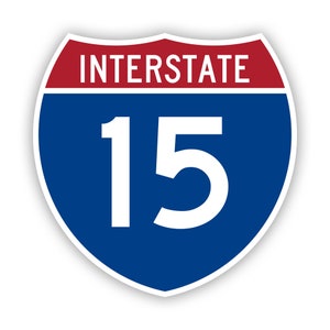 May include: A blue and red interstate highway sign with white text and the number 15.