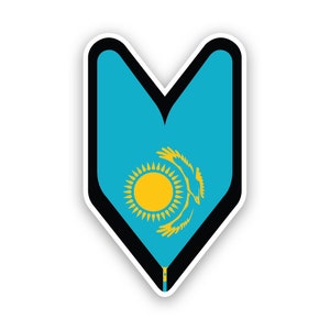 May include: A blue and yellow sticker featuring the flag of Kazakhstan in the shape of a heart. The flag depicts a golden sun with 32 rays and a stylised flying eagle.