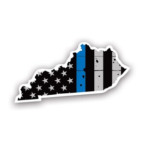 May include: A sticker in the shape of Kentucky, featuring a distressed American flag design. The flag incorporates a blue line, black and gray stripes, and white stars on a black background. The sticker has a white border.