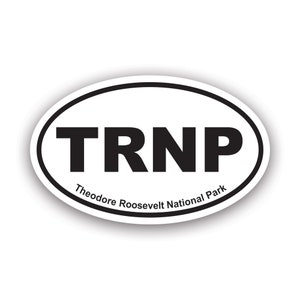 May include: White oval sticker with black text that reads "TRNP Theodore Roosevelt National Park".