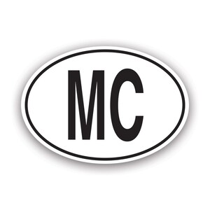 May include: White oval sticker with black text that reads "MC".