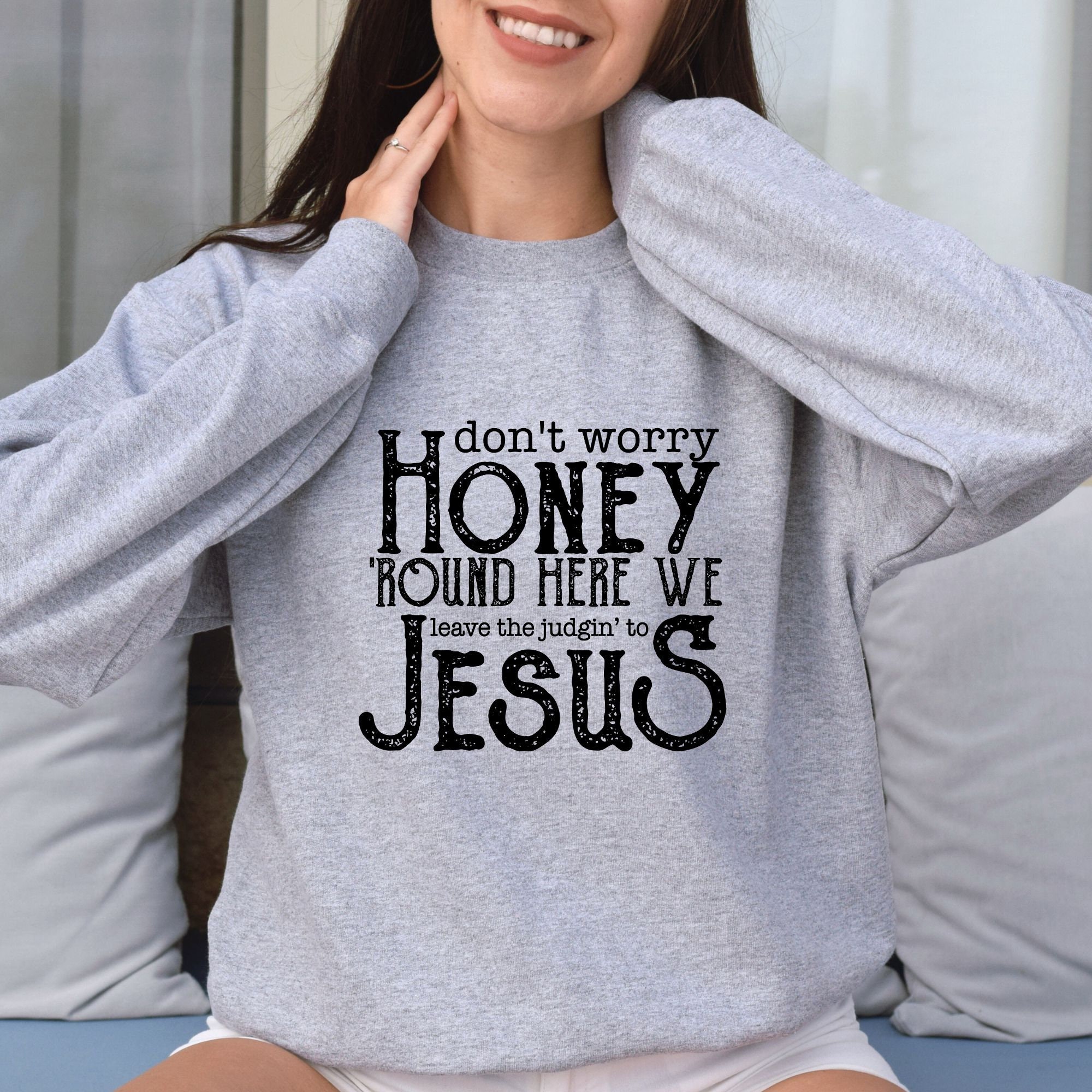 Around here we leave the judging to Jesus sweatshirt main image 0