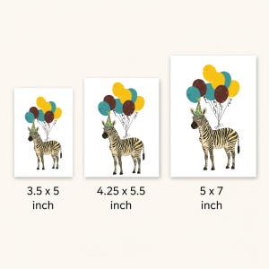 May include: Three white art prints featuring a zebra wearing a party hat and holding balloons. The prints are labeled with their dimensions: 3.5 x 5 inches, 4.25 x 5.5 inches, and 5 x 7 inches. The balloons are yellow, teal, and brown.