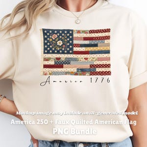 May include: Cream-colored t-shirt featuring a faux quilted American flag design. The flag includes a blue field with floral accents and stars, and red and white stripes. The word "America" and the number "1776" are printed below the flag.