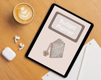 May include: A digital tablet with a beige background and the text "Budget Planner" in a brown rectangle. A black and white illustration of a closed book with a key attached to it is on the screen.
