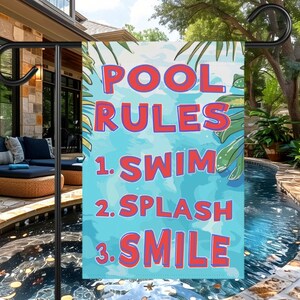May include: A rectangular garden flag with the words "POOL RULES" in red block letters. Below, the rules are listed: 1. SWIM, 2. SPLASH, 3. SMILE. The background is blue with green leaves.