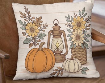 May include: Decorative throw pillow featuring a fall harvest design. The pillow displays an orange pumpkin, a white pumpkin, a vintage lantern, and yellow sunflowers. The background has a wood-grain pattern, creating a rustic aesthetic.