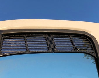 May include: Black rear window louvers for a car. The louvers are made of a black mesh material and are attached to the rear window of the car.