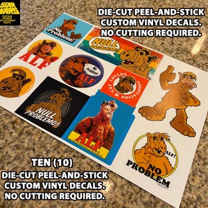 May include: Sheet of ten die-cut, peel-and-stick custom vinyl decals featuring the character ALF. Decals include various images of ALF with the phrases "No Problem!" and "Null Problemo!" printed on them. The Star Wars logo is in the upper left corner.