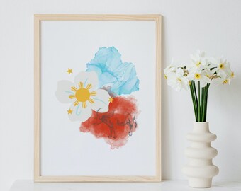 Può includere: Una stampa incorniciata con un design ad acquerello della bandiera filippina. La bandiera è rappresentata da un fiore bianco con un sole giallo al centro, una nuvola blu e una nuvola rossa con un'immagine stilizzata di un carabao.