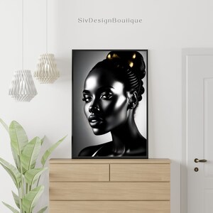 May include: Black and white portrait of a woman with gold accents in her hair. The woman is looking to the right of the frame. The background is a gradient of gray.