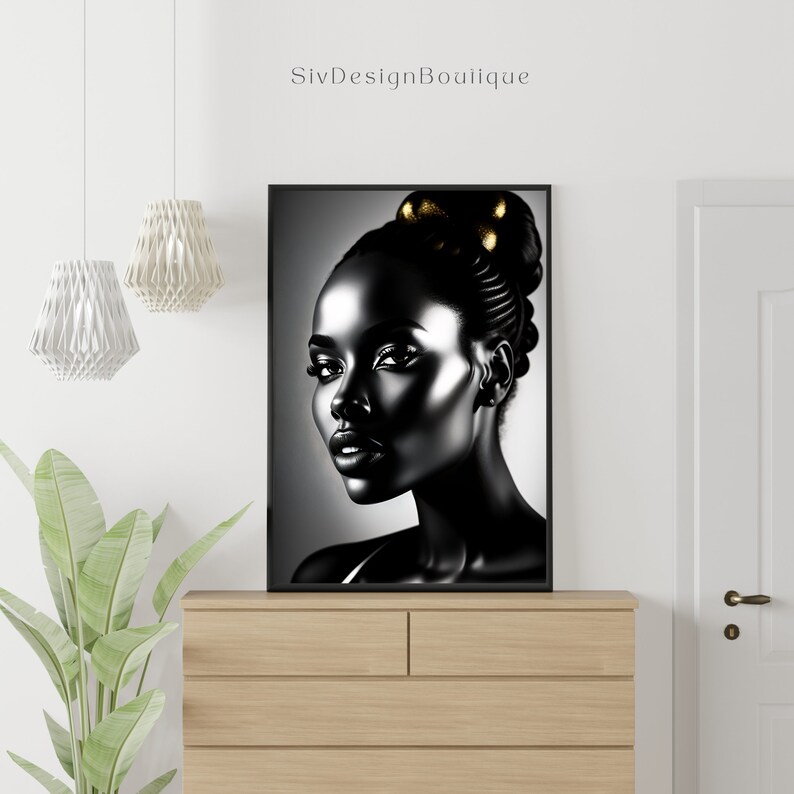 May include: Black and white portrait of a woman with gold accents in her hair. The woman is looking to the right of the frame. The background is a gradient of gray.