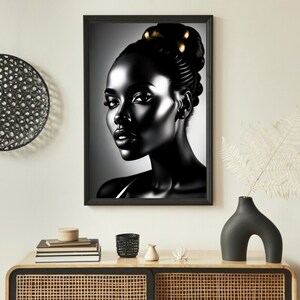 May include: Black and white portrait of a woman with gold accents in her hair. The woman is looking to the right of the frame. The background is a gradient of gray.