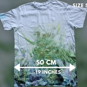 May include: White tie-dye t-shirt with green and blue accents. The shirt is size S and measures 19 inches across the chest.